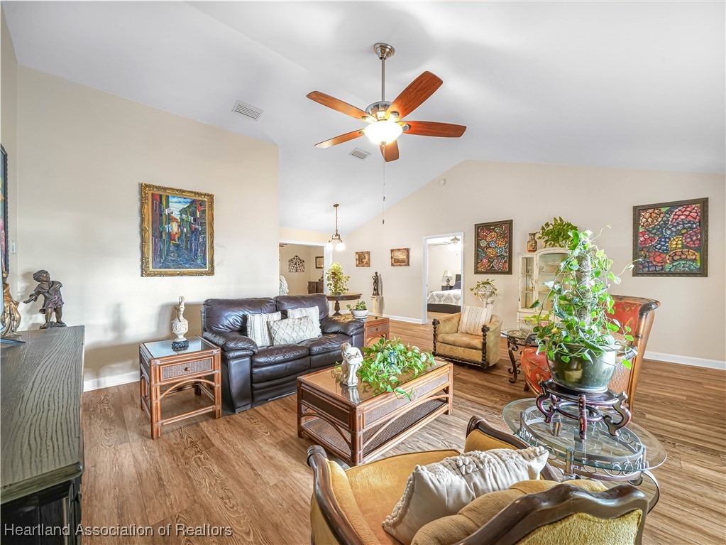 5342 Lime Road Sebring, FL 33875 - Photo 2 of 47 SOARING CATHEDRAL CEILINGS, THE EXPANSIVE LIVING AREA