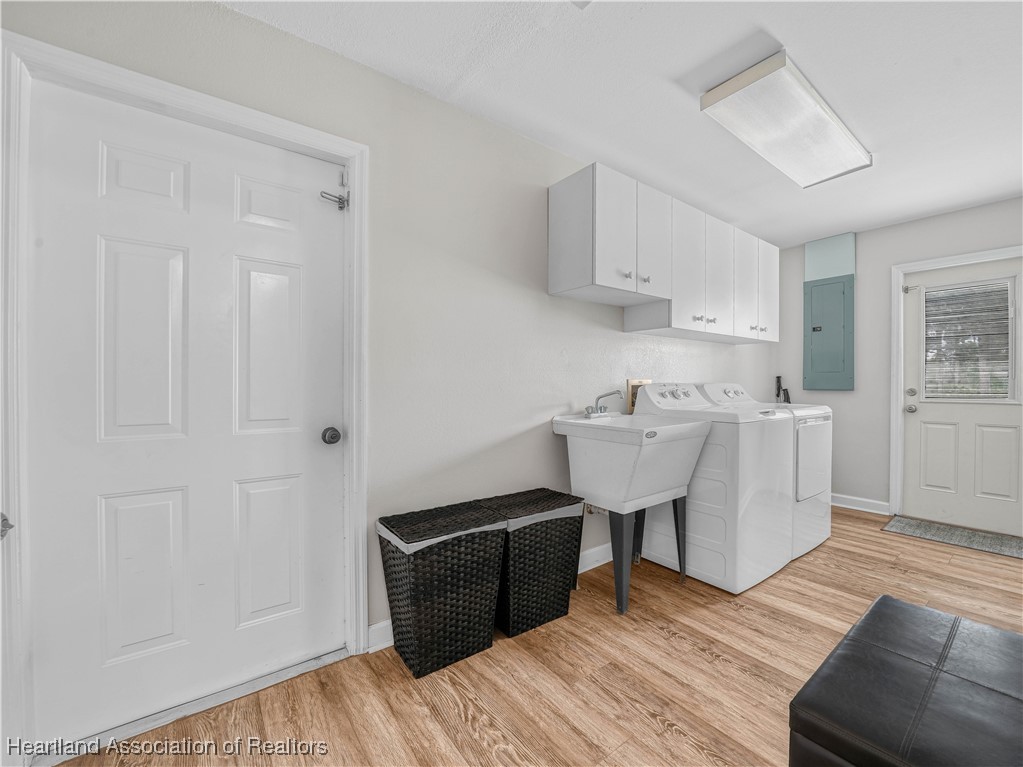 5342 Lime Road Sebring, FL 33875 - Photo 23 of 47 SPACIOUS LAUNDRY, DOOR LEADS TO MOTHER-IN-LAW SUITE ACROSS THE DRIVEWAY