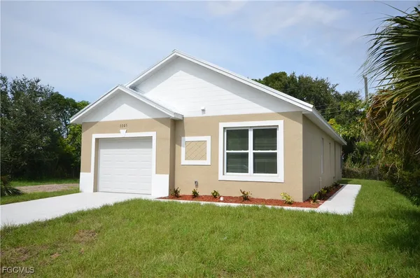 front view of a house with a yard