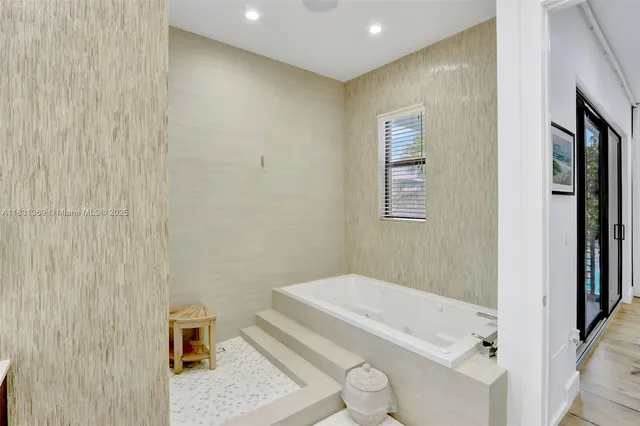 a bathroom with a granite countertop sink a toilet and shower
