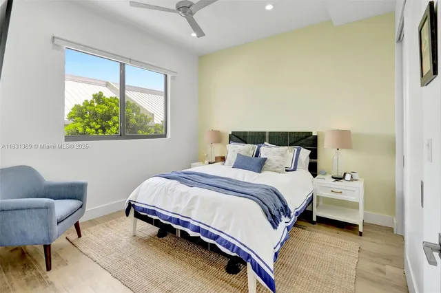 a bedroom with a bed and a chair