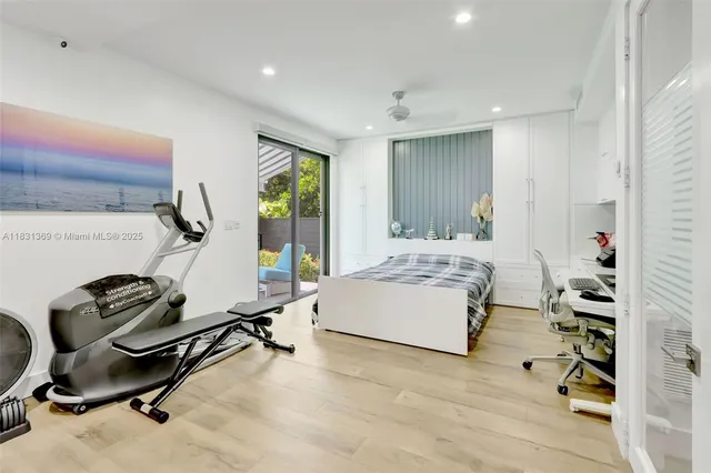 a room with gym equipment and a table