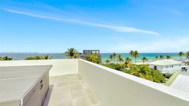 a view of a swimming pool with an ocean view