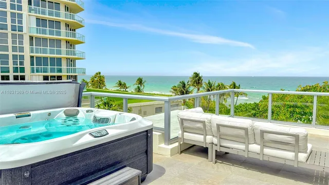 a view of a chairs and table in a balcony
