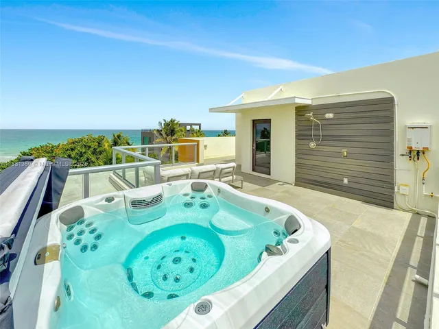 a view of swimming pool with outdoor seating and yard