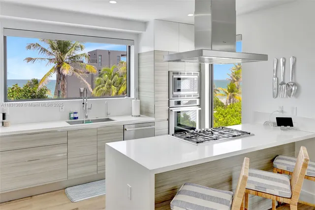 a kitchen with a stove a refrigerator and a sink