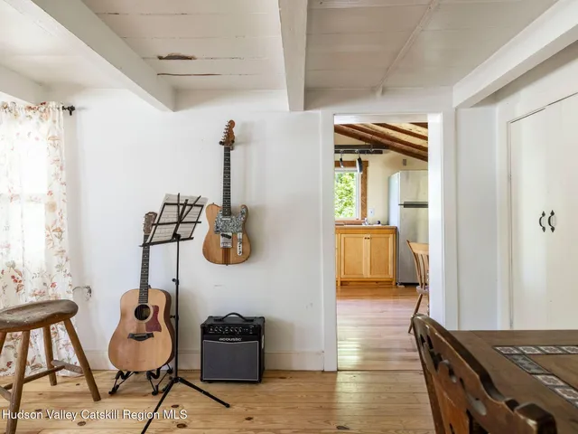 a hallway with a couch and chandelier