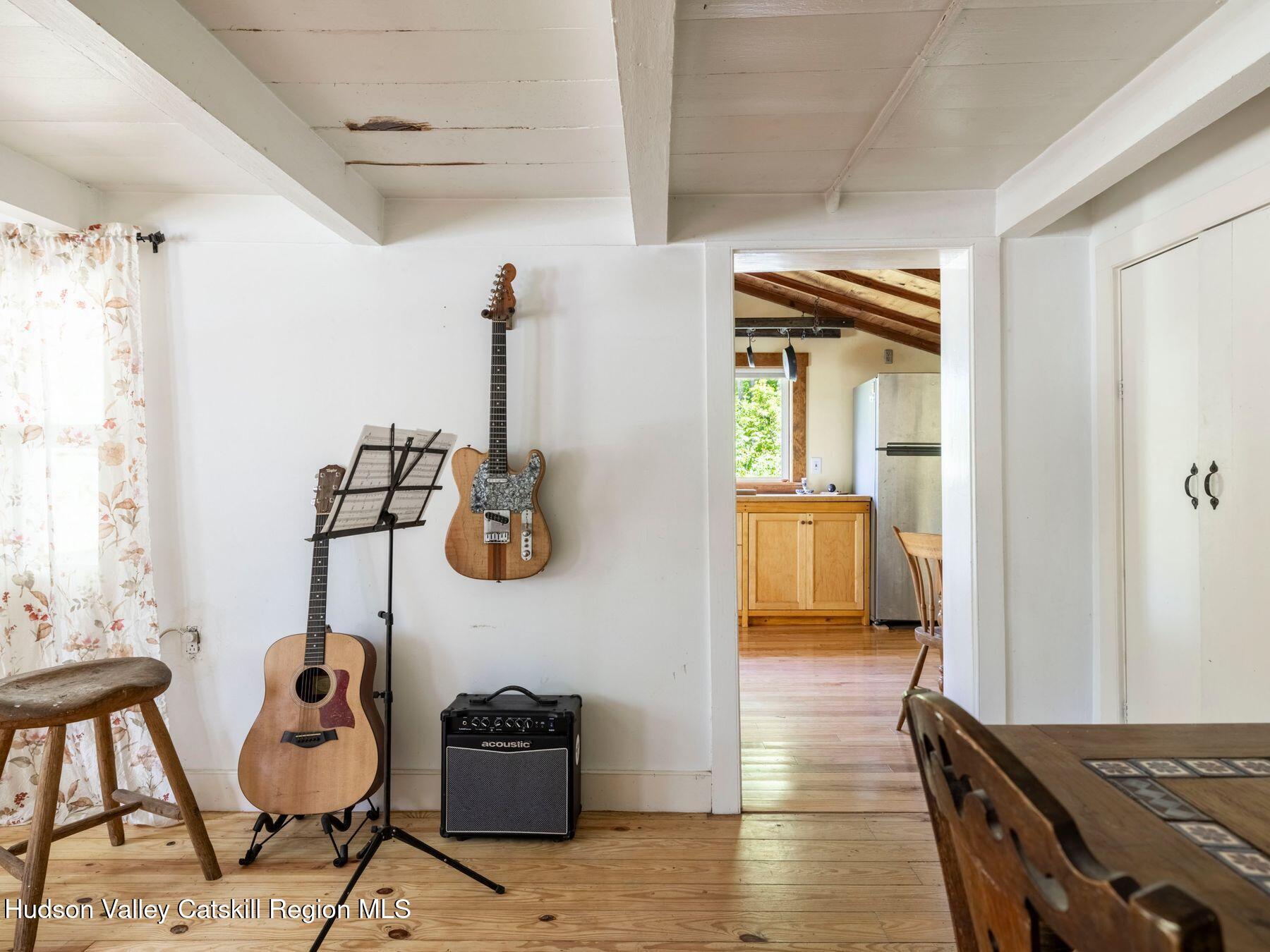 452 County Road 2 Accord, NY 12404 - Photo 12 of 45 a hallway with a couch and chandelier