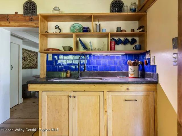 a kitchen with stainless steel appliances granite countertop a stove and cabinets