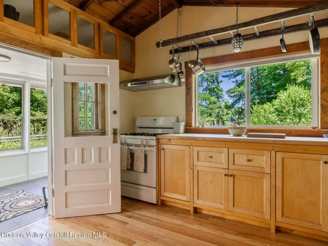 a kitchen with a stove and a window