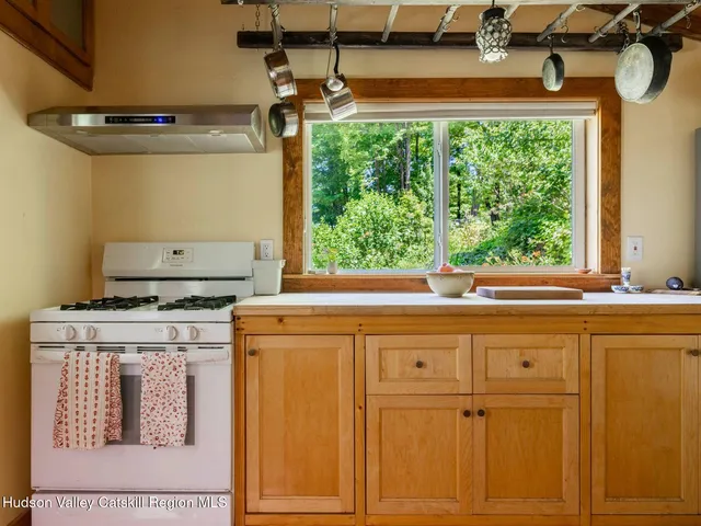 a view of a dining room with furniture and a window
