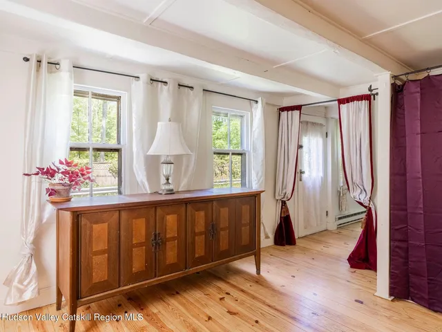 a bed room with a bed and a chair