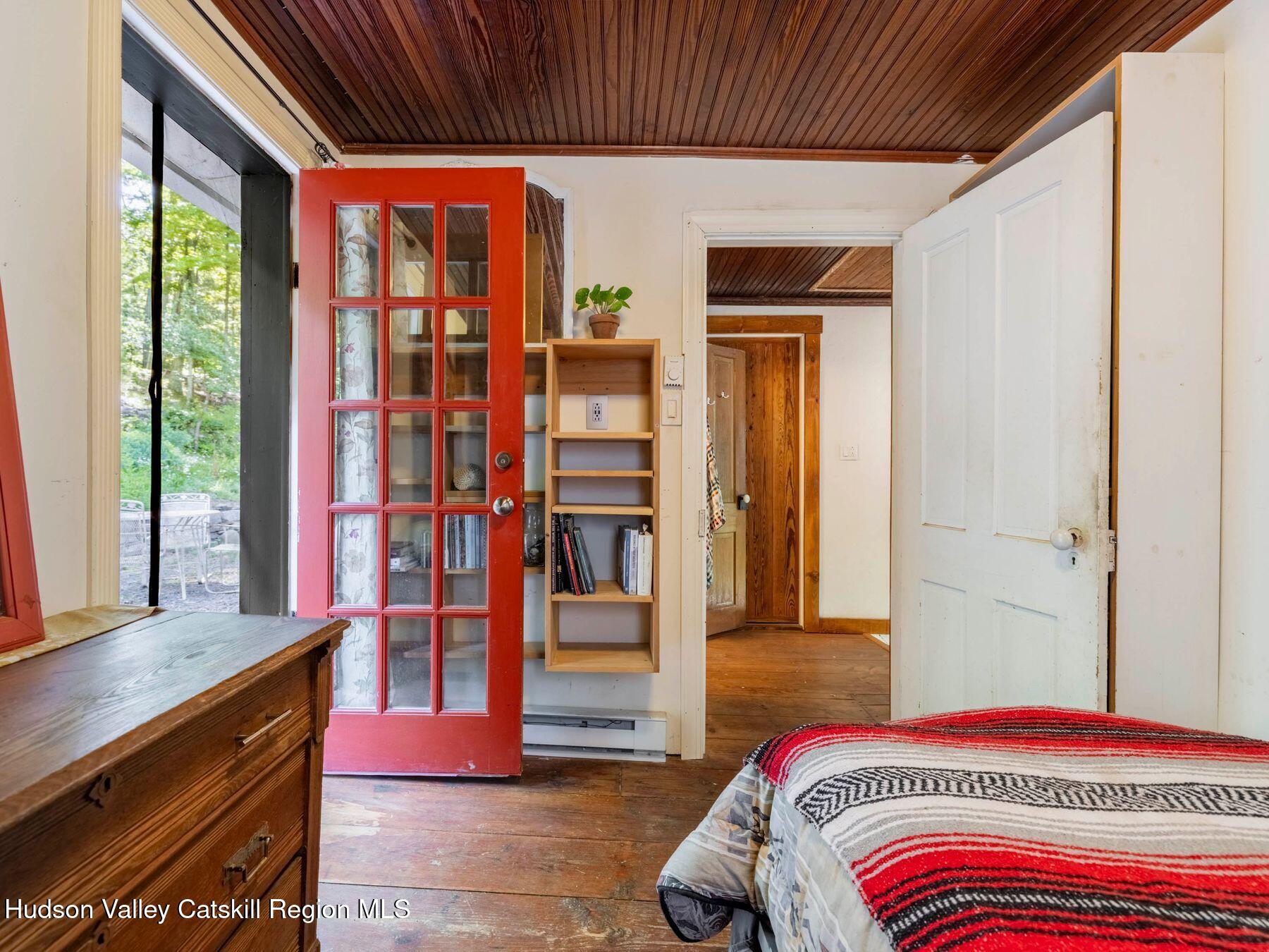 452 County Road 2 Accord, NY 12404 - Photo 25 of 45 a bedroom with a bed and wooden floor