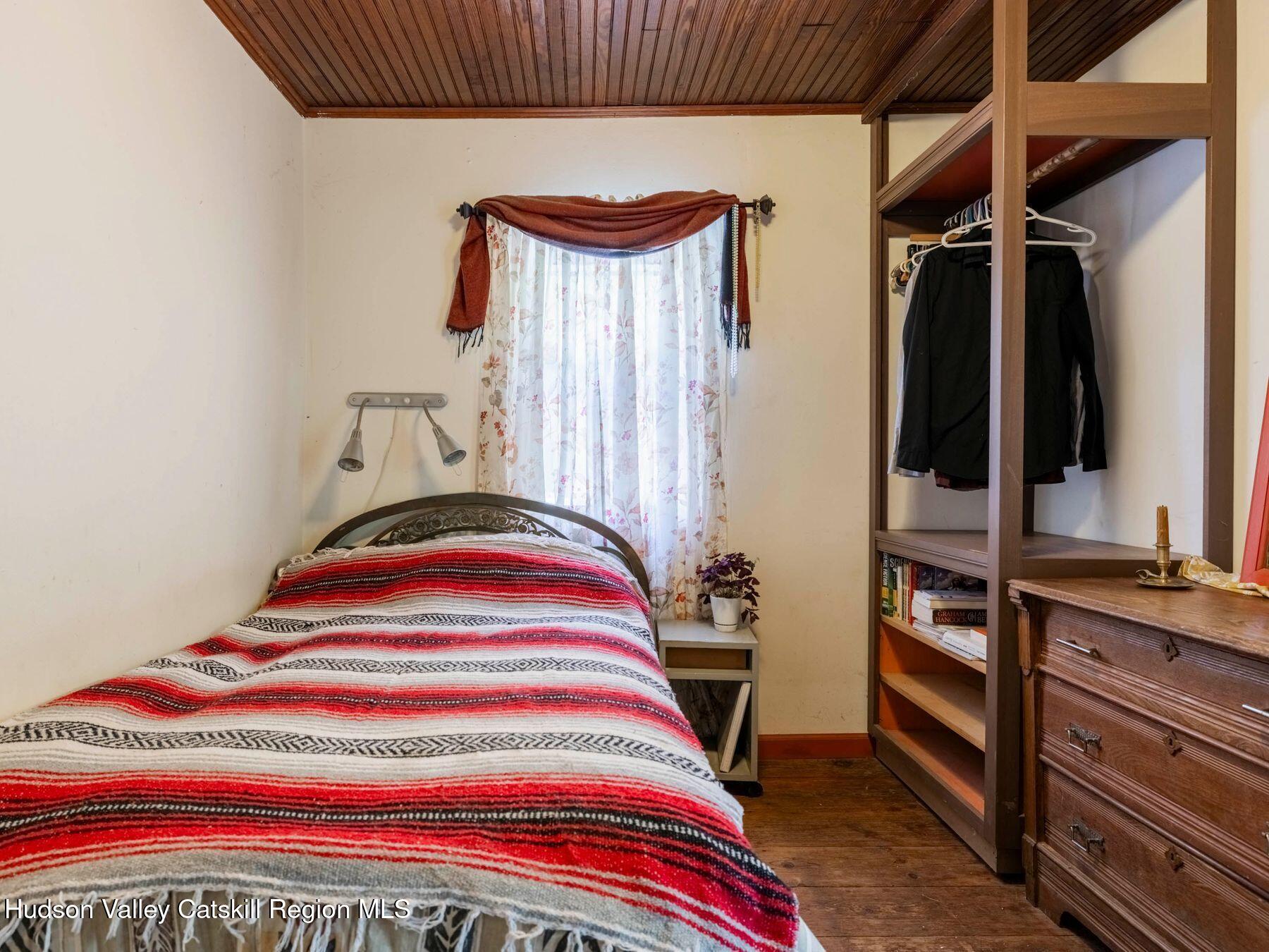 452 County Road 2 Accord, NY 12404 - Photo 27 of 45 a bedroom with a bed and a dresser