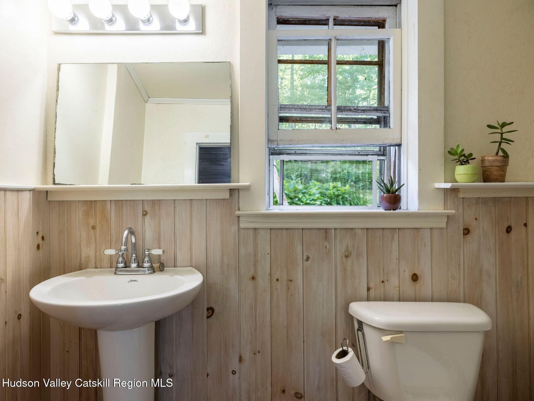 452 County Road 2 Accord, NY 12404 - Photo 29 of 45 a bathroom with a sink a toilet and mirror