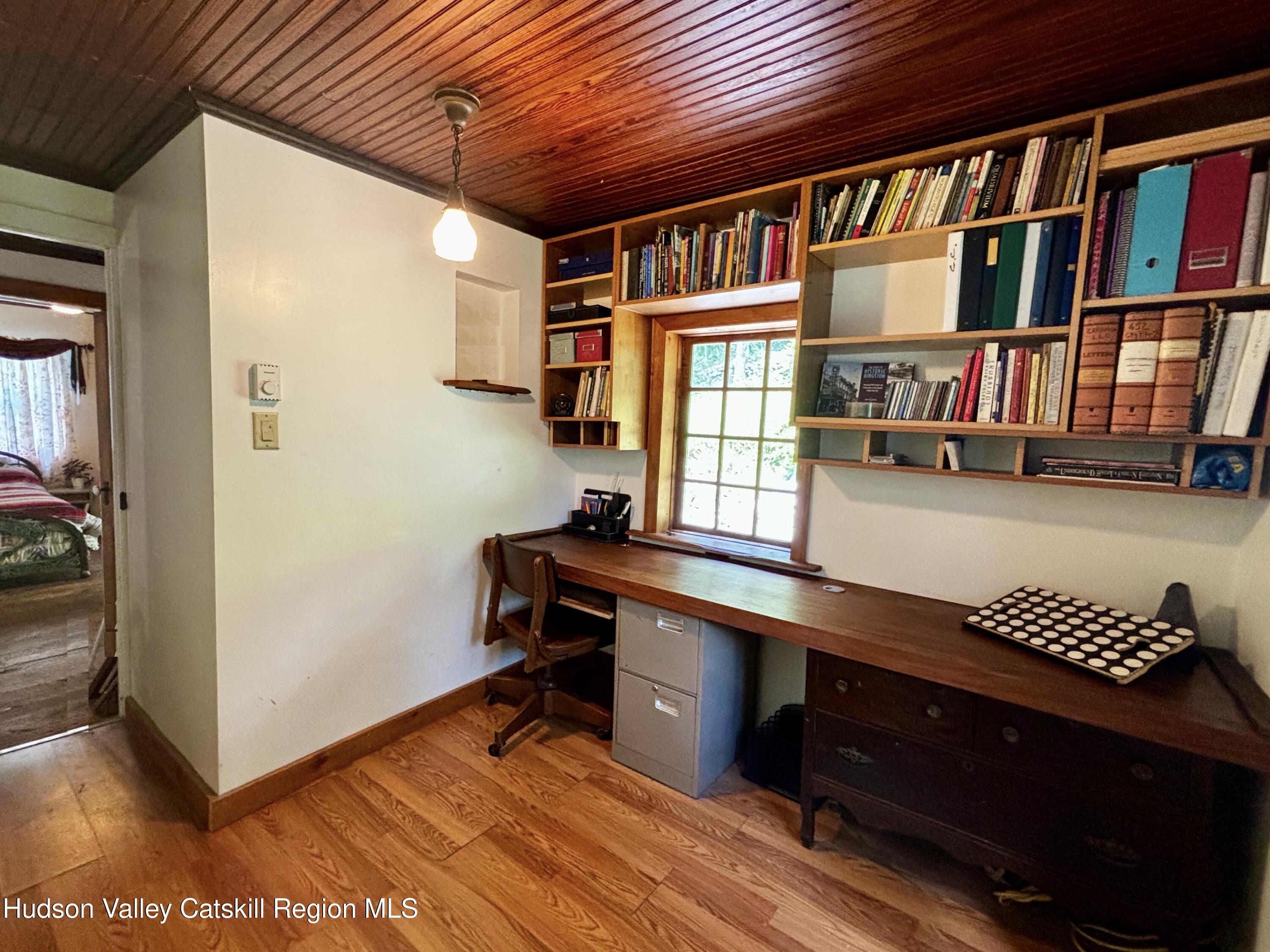 452 County Road 2 Accord, NY 12404 - Photo 35 of 45 a hallway with a large window and book shelf