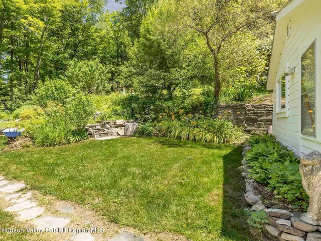 a view of a patio with table and chairs and potted plants