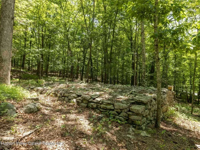 a view of house with garden space and sitting space