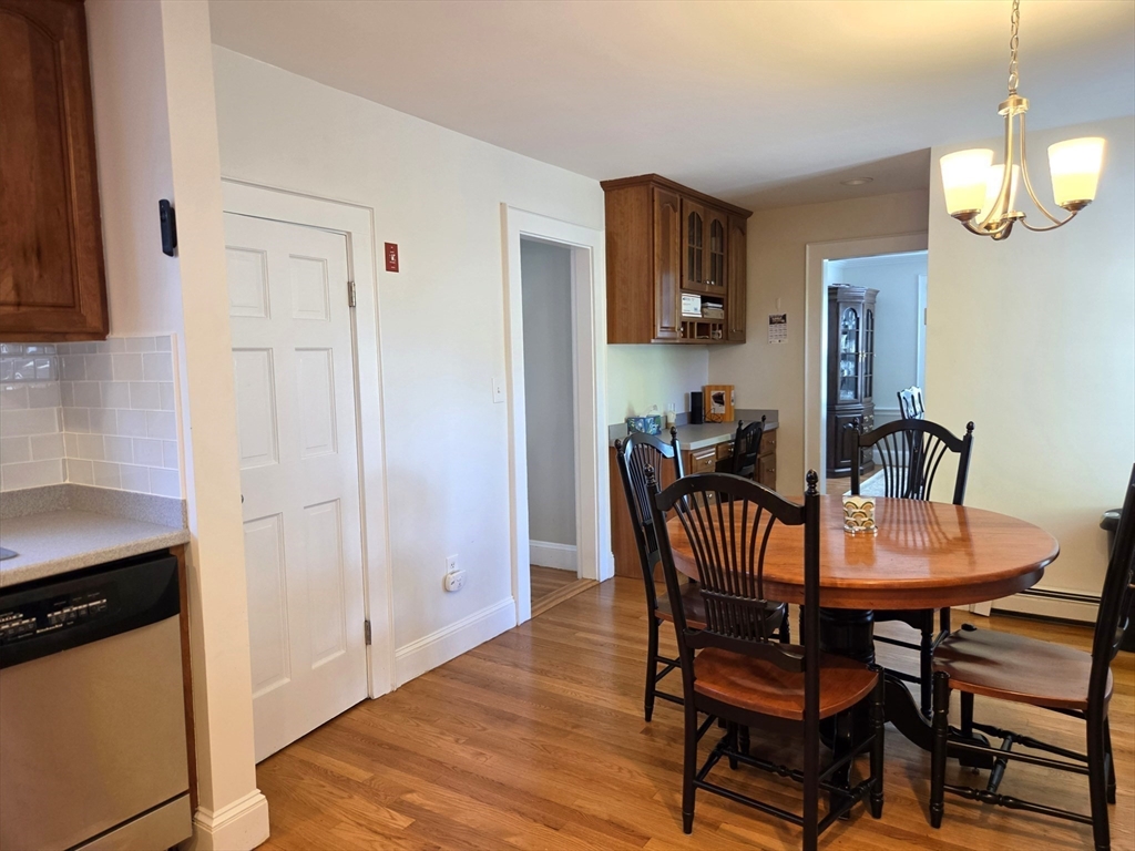 25 Waldeck Road Milton, MA 02186 - Photo 12 of 34 a dining room with furniture and window