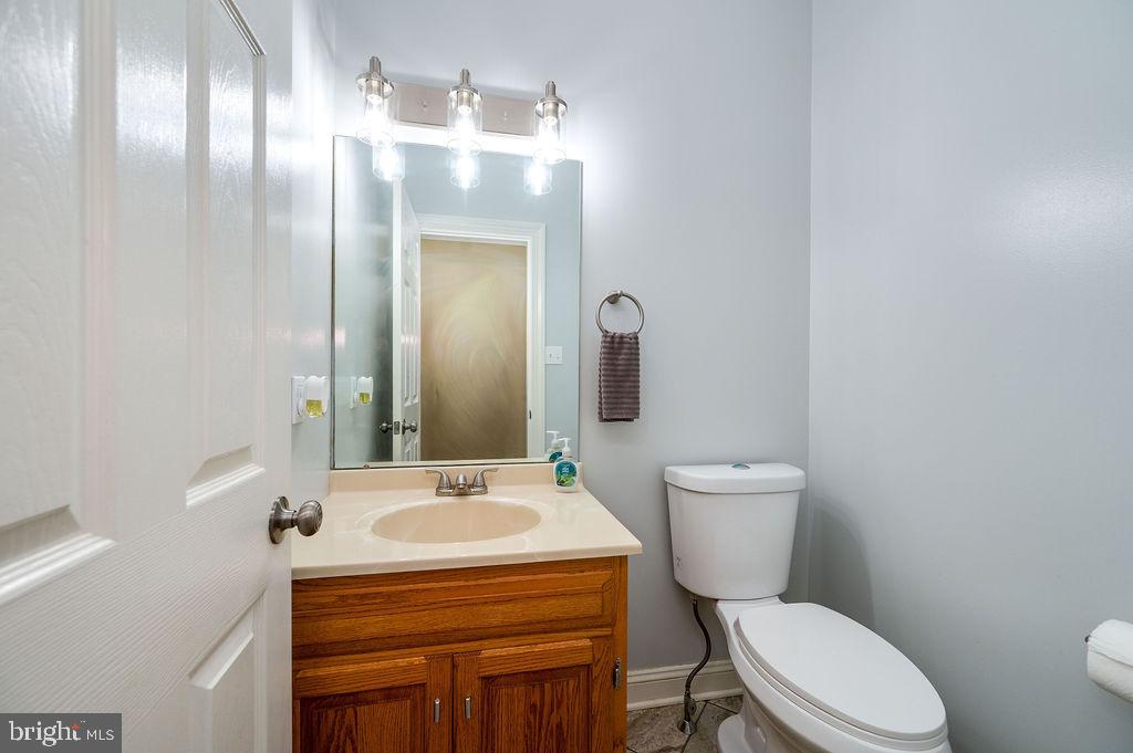 24 Sycamore Drive Reading, PA 19606 - Photo 21 of 56 a bathroom with a sink a toilet a mirror and shower