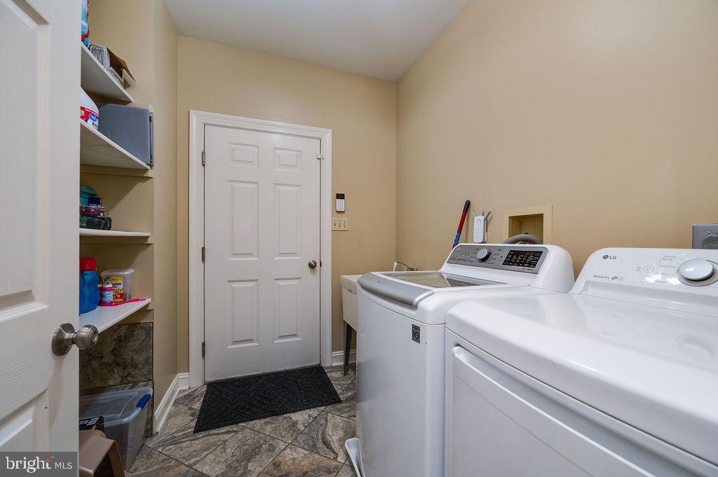 24 Sycamore Drive Reading, PA 19606 - Photo 22 of 56 Laundry/Mud room with sink and storage shelves.