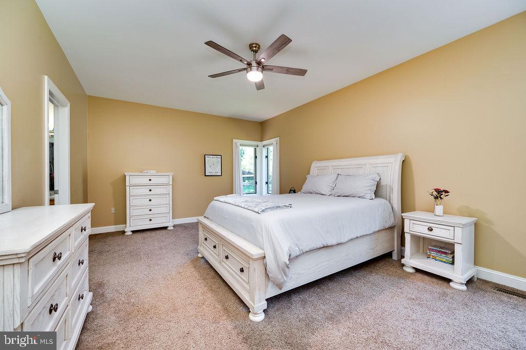24 Sycamore Drive Reading, PA 19606 - Photo 23 of 56 a spacious bedroom with a bed and a cabinets