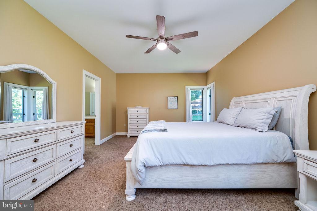 24 Sycamore Drive Reading, PA 19606 - Photo 24 of 56 a bedroom with a large bed and ceiling fan
