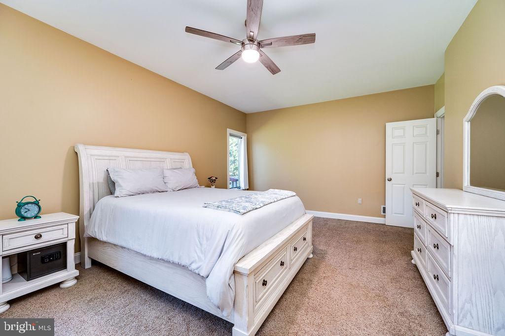 24 Sycamore Drive Reading, PA 19606 - Photo 25 of 56 a bedroom with a bed and a chandelier