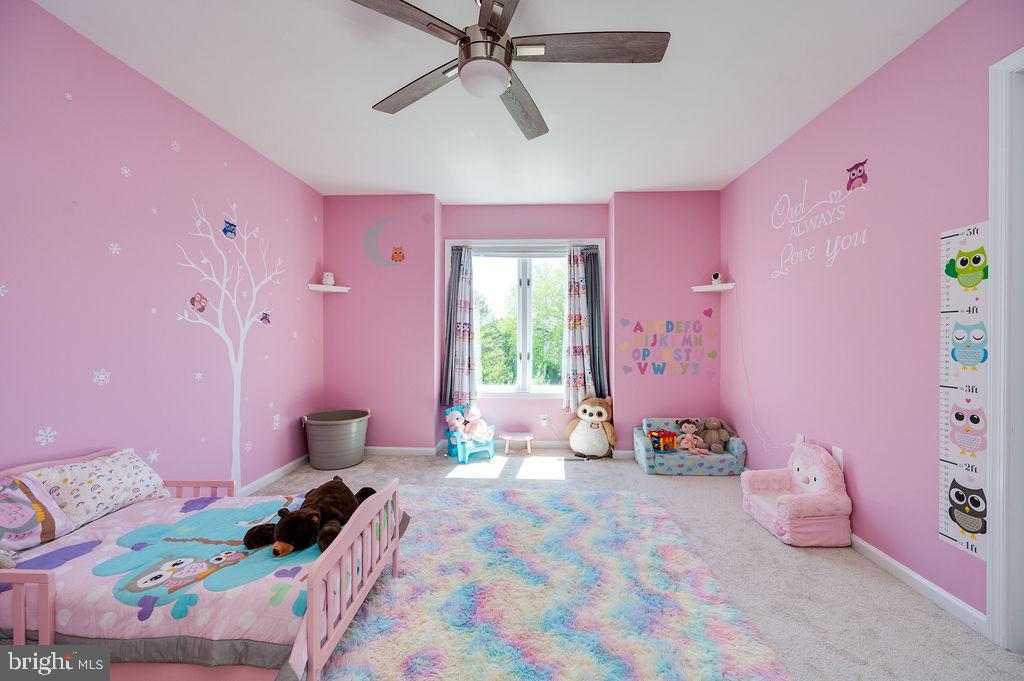 24 Sycamore Drive Reading, PA 19606 - Photo 30 of 56 a bedroom with pink bed and pink walls