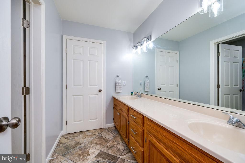 24 Sycamore Drive Reading, PA 19606 - Photo 33 of 56 a bathroom with a sink and a mirror
