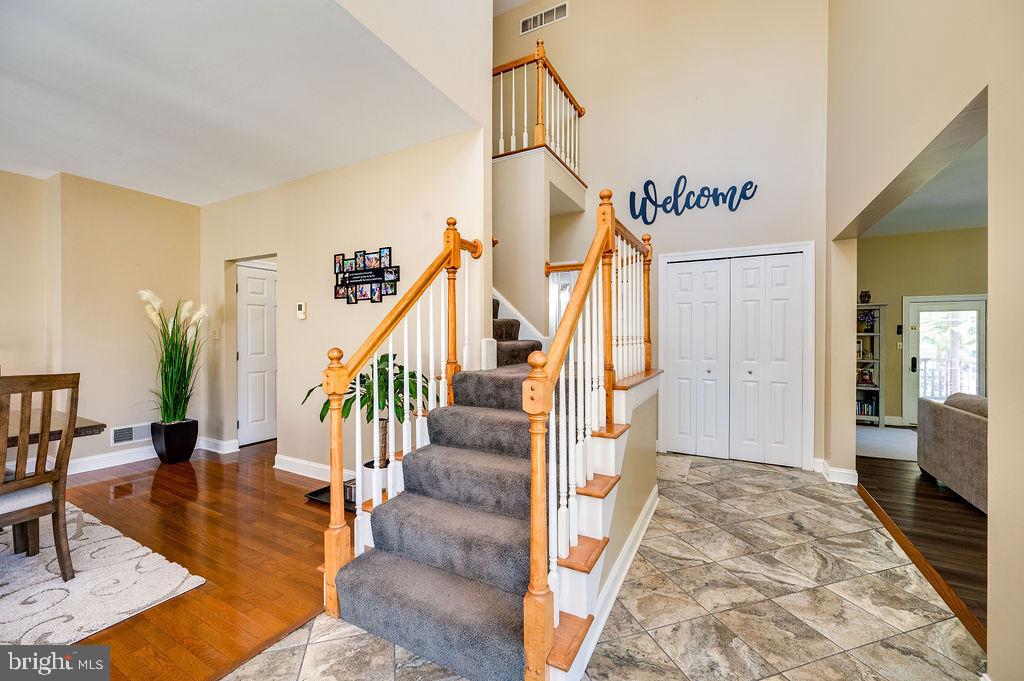 24 Sycamore Drive Reading, PA 19606 - Photo 4 of 56 a view of a hallway with wooden floor and staircase