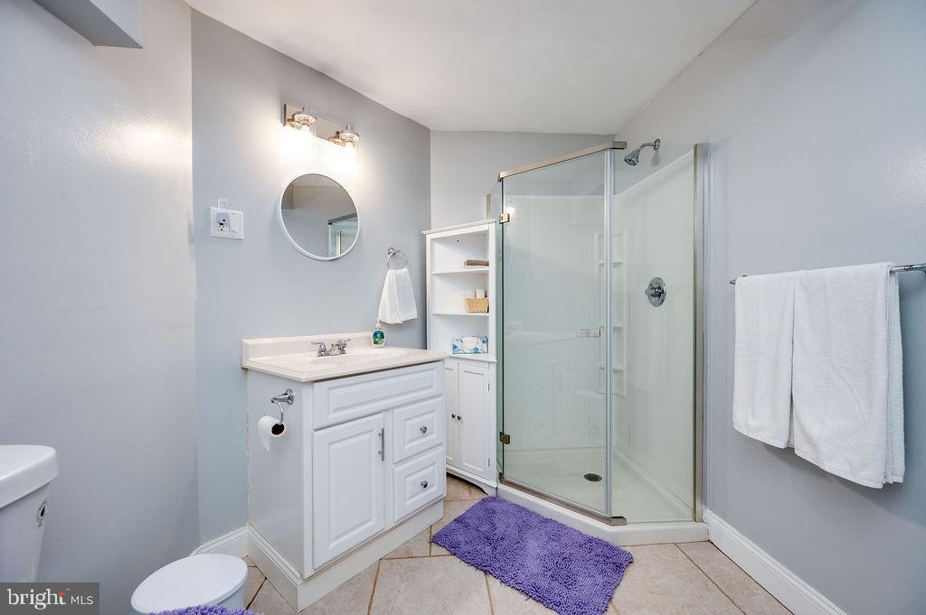 24 Sycamore Drive Reading, PA 19606 - Photo 46 of 56 a bathroom with a sink mirror and toilet