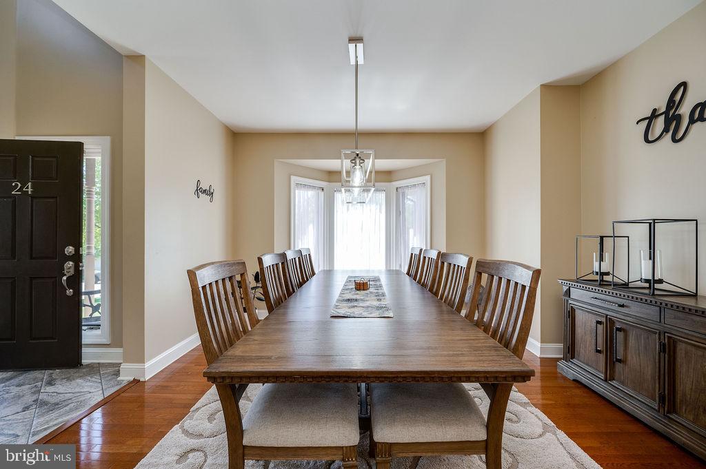 24 Sycamore Drive Reading, PA 19606 - Photo 8 of 56 a view of a a dining room with furniture window and wooden floor