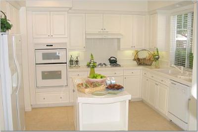 27 Alconbury Way Novato, CA 94949 - Photo 2 of 10 a kitchen with stainless steel appliances white cabinets and a refrigerator