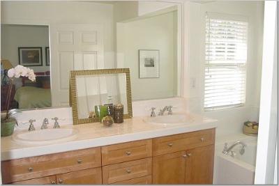 27 Alconbury Way Novato, CA 94949 - Photo 8 of 10 a bathroom with a double vanity sink and a mirror