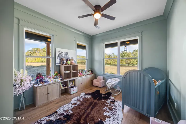 a spacious bedroom with a bed and windows