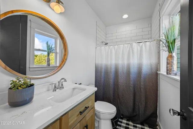 a view of house with yard and entertaining space