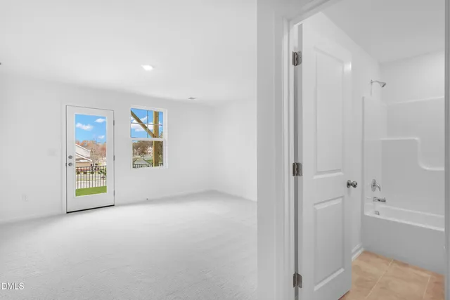 a bathroom with a bathtub and a toilet