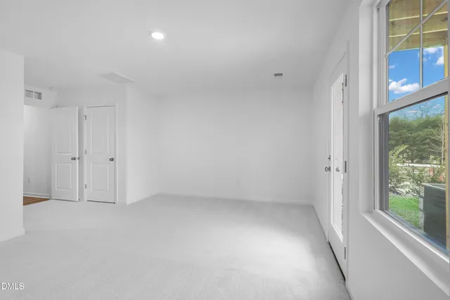 an empty room with windows