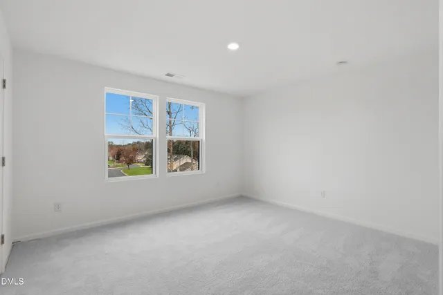 a bathroom with a toilet a sink and a mirror