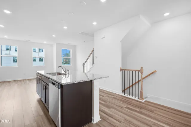 a stove top oven sitting inside of a kitchen