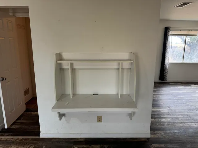 a bathroom with a toilet and shower