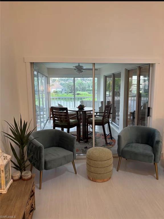 14993 Rivers Edge Court, Unit 246 Fort Myers, FL 33908 - Photo 2 of 23 a living room with furniture and large windows