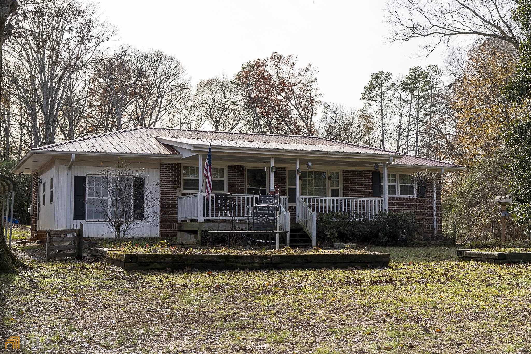 2111 Prospect Road Carnesville, GA 30521 - Photo 1 of 1 a front view of a house with yard