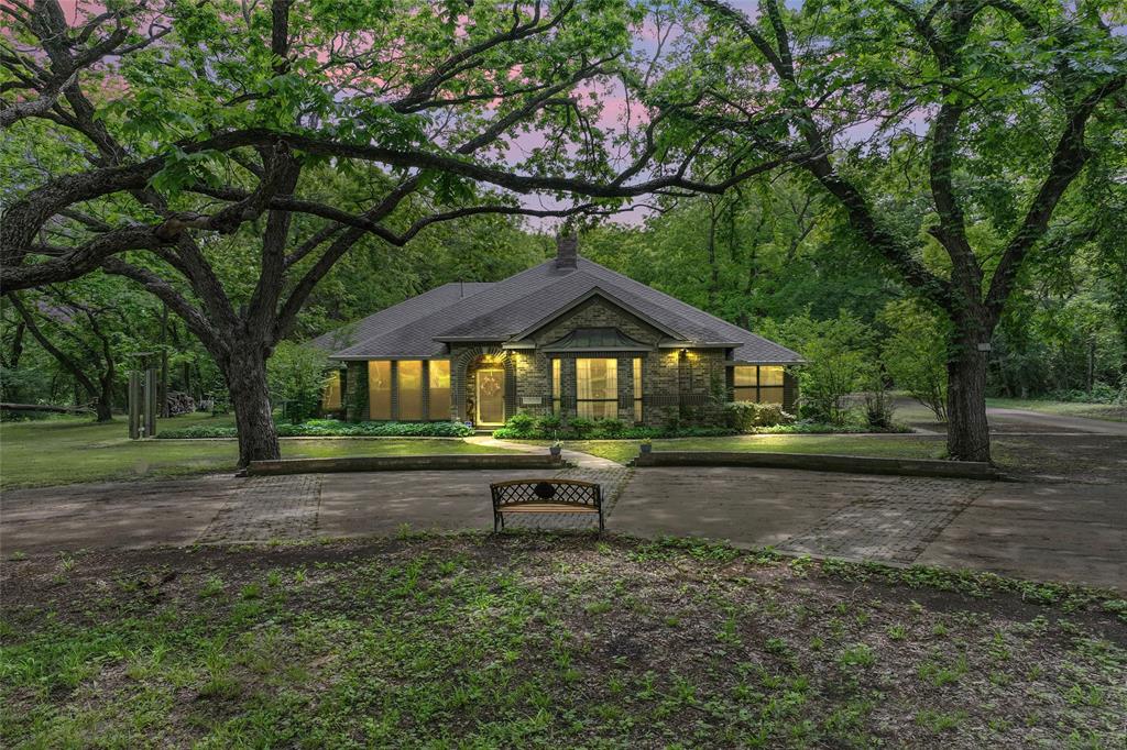 Front of 3800 SF home.  Front yard is full of trees and natural landscaping.  