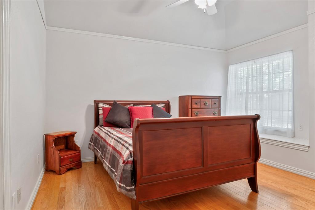 3650 Mt Zion Road Midlothian, TX 76065 - Photo 15 of 38 Front bedroom that is across the hall from a full bathroom. When the drapes are pulled back, the window allows a beautiful view of trees and wonderful land. On the far left side of the photo you can see a door. This door leads into the bedroom next door.