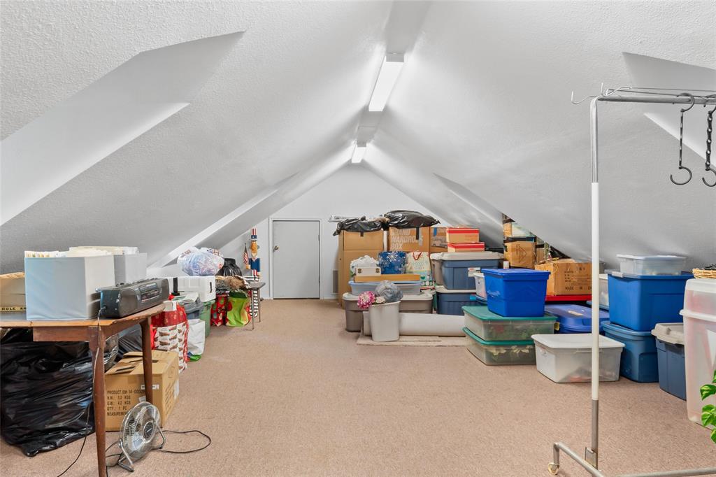 3650 Mt Zion Road Midlothian, TX 76065 - Photo 25 of 38 This bonus room has a stair case in the garage. This room can be a game room, bedroom, etc. The far small door is to the attic with where the HVAC system is located.