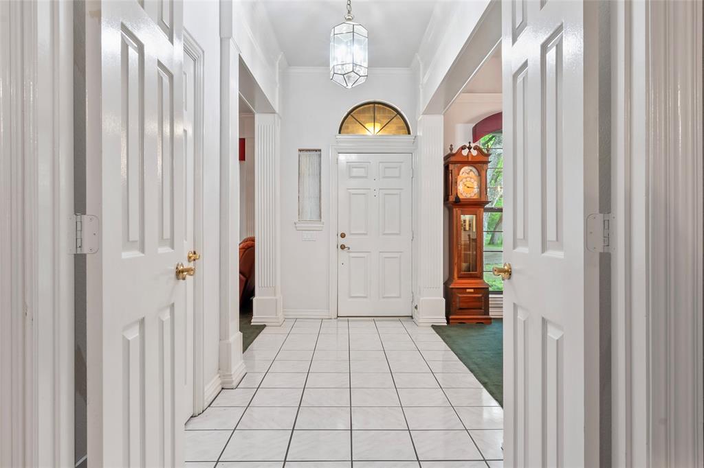 3650 Mt Zion Road Midlothian, TX 76065 - Photo 5 of 38 Beautiful custom plantation style entry. Lots of added wood trim throughout the home.