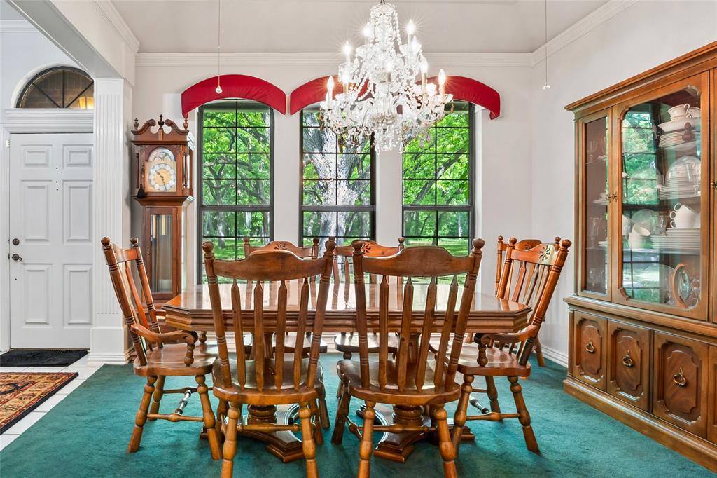 3650 Mt Zion Road Midlothian, TX 76065 - Photo 7 of 38 Large dining room is roughly 12 x 12 and is across the entry way from living area. The Chandelier does not convey.