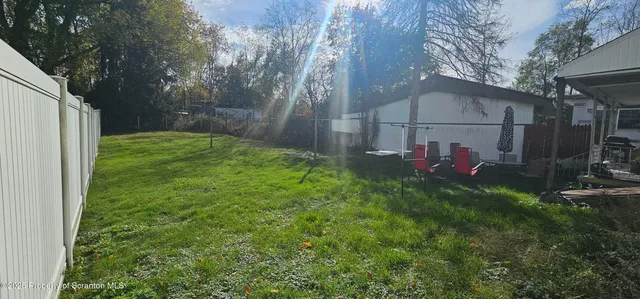 a view of back yard of the house
